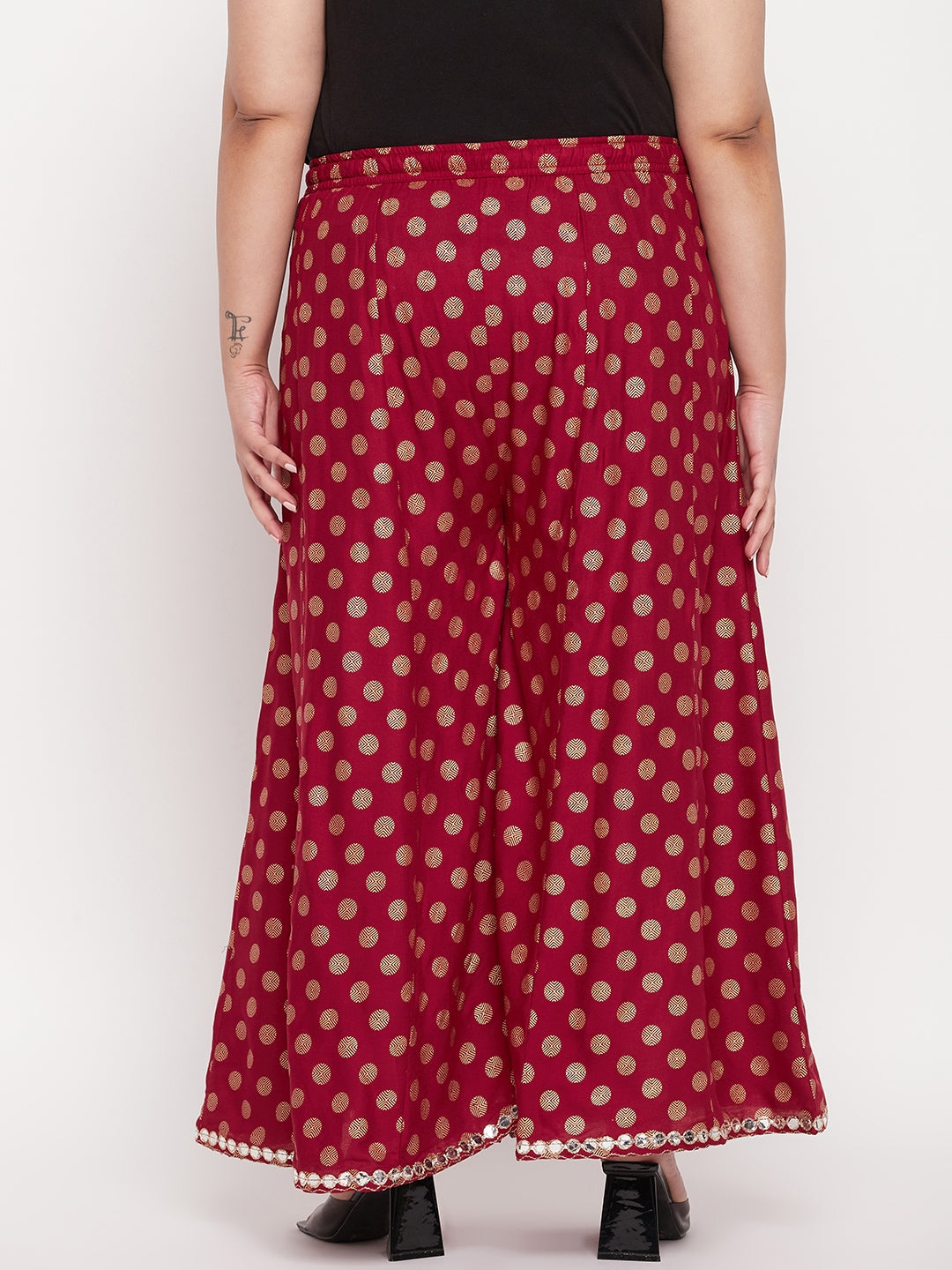 Maroon polka dot rayon sharara with elasticated waistband and drawstring.