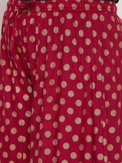 Maroon polka dot rayon sharara with elasticated waistband and drawstring.