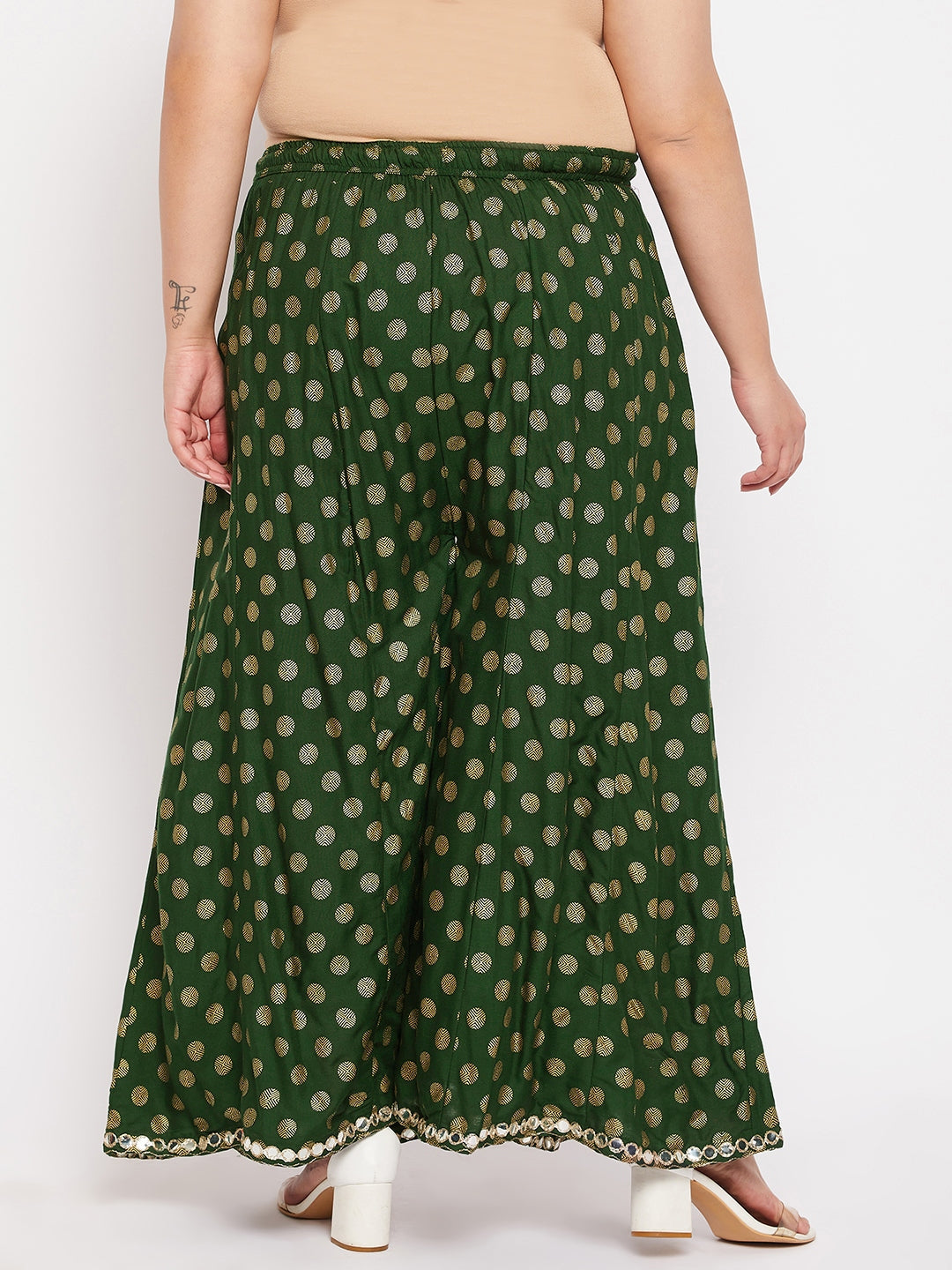 Bottle green polka dot rayon sharara with elasticated waistband and drawstring.