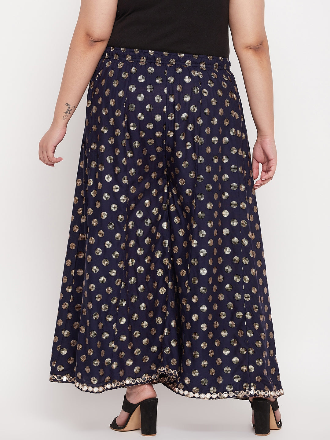 Navy blue polka dot rayon sharara with elasticated waistband and drawstring.