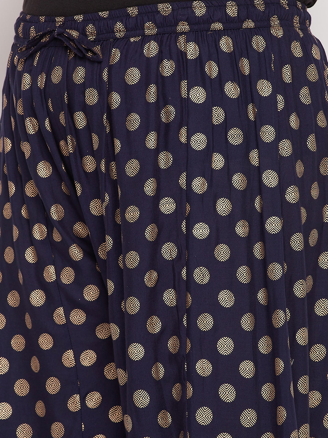 Navy blue polka dot rayon sharara with elasticated waistband and drawstring.