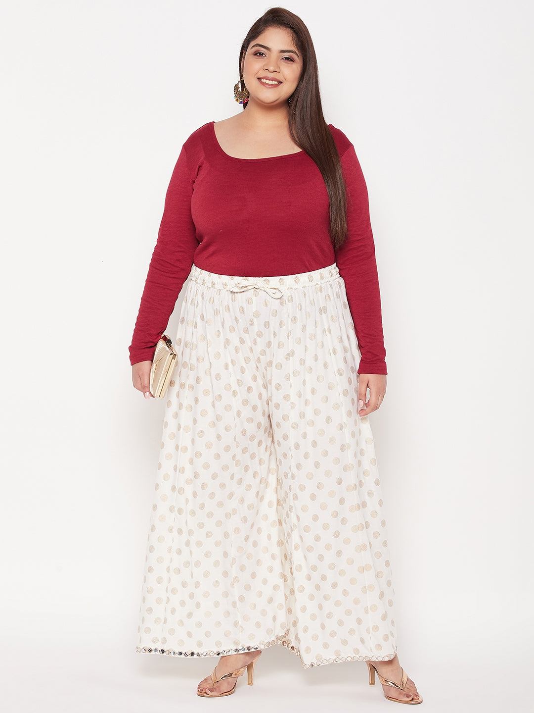 Cream polka dot rayon sharara with elasticated waistband and drawstring.