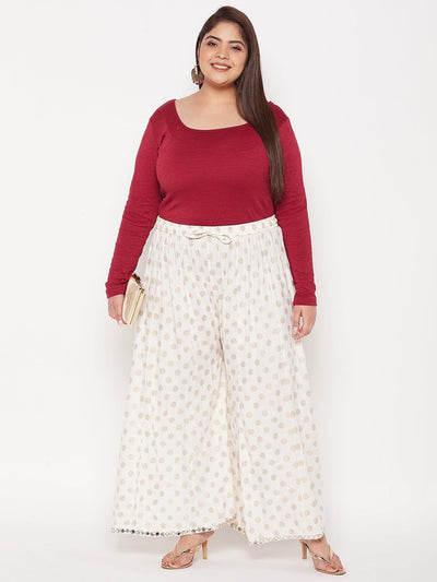 Cream polka dot rayon sharara with elasticated waistband and drawstring.