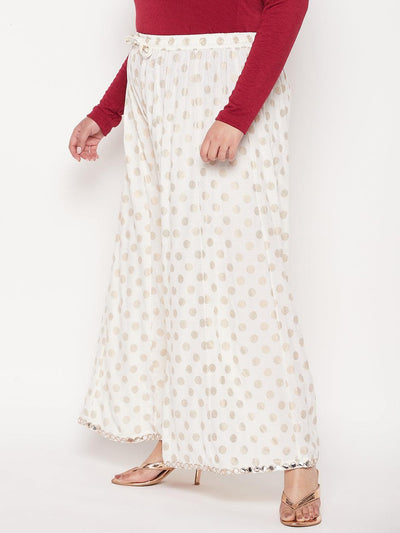 Cream polka dot rayon sharara with wide legs and elasticated waistband.