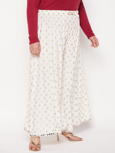 Cream polka dot rayon sharara with wide leg design and elasticated waistband.
