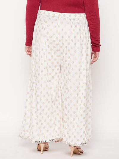 Cream polka dot rayon sharara with wide legs and elasticated waistband.