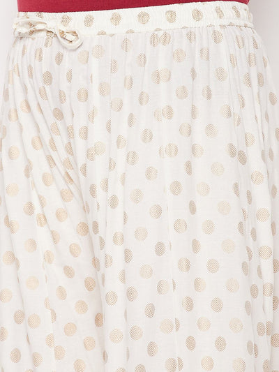Cream polka dot rayon sharara with elasticated waistband and drawstring.