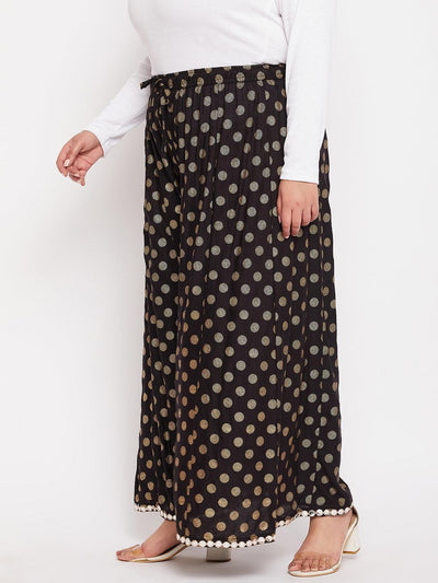 Black polka dot rayon sharara with elasticated waistband and drawstring.