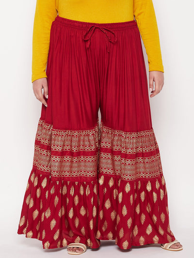 Maroon printed rayon flared gharara with elasticated waistband and drawstring.
