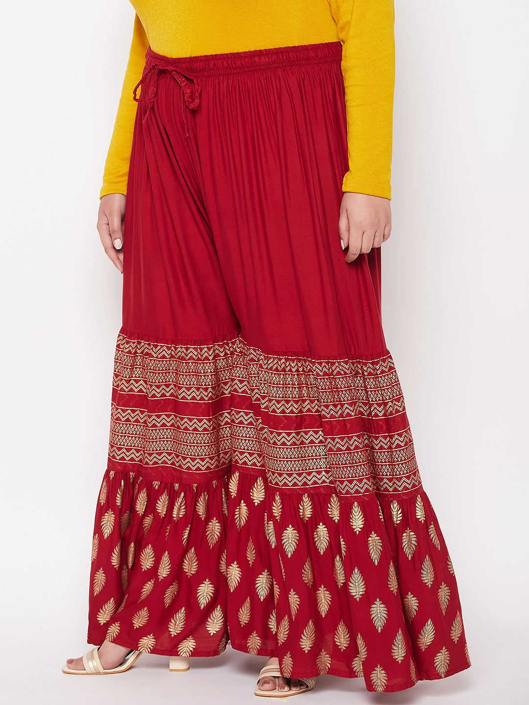 Maroon printed rayon flared gharara with elasticated waistband and drawstring.