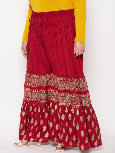 Maroon printed rayon flared gharara with elasticated waistband and drawstring.