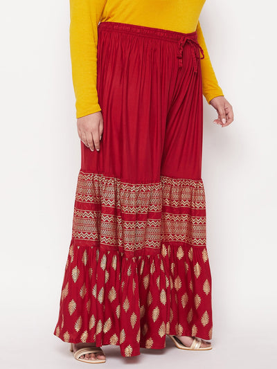 Maroon printed rayon flared gharara with elastic waistband and drawstring.