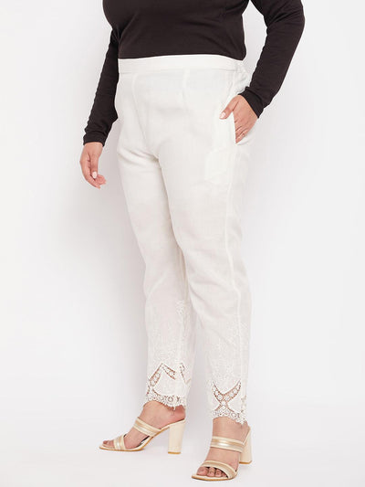 Off-White solid cotton embroidered pant with ankle length and partially elasticated waistband.