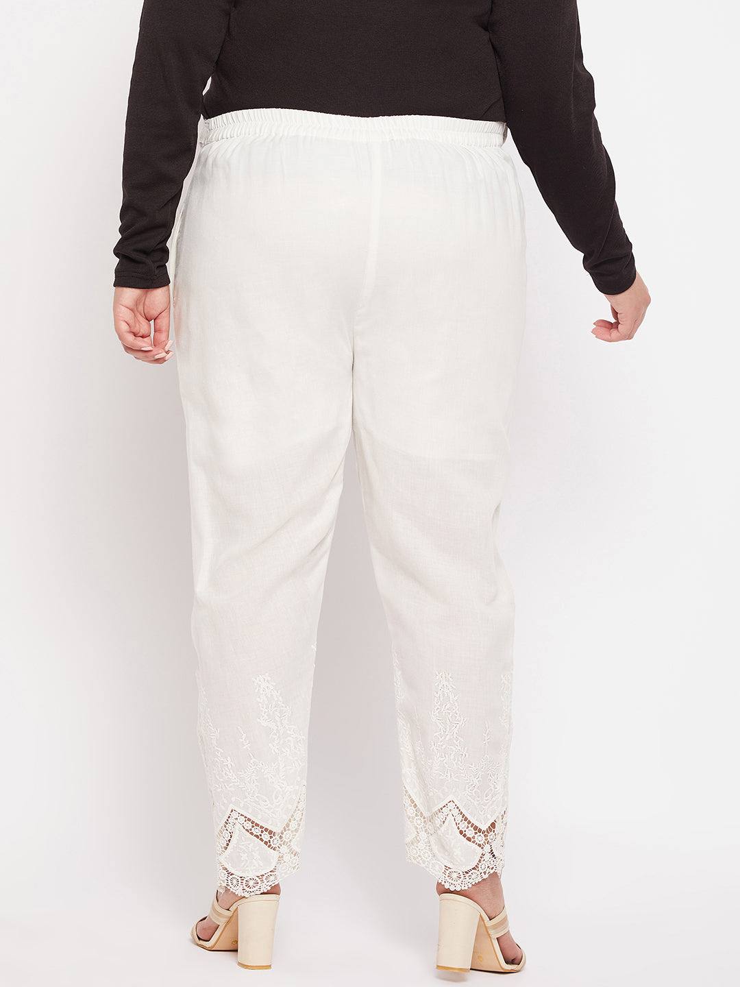Off-white solid cotton embroidered ankle-length pant with partially elasticated waistband.