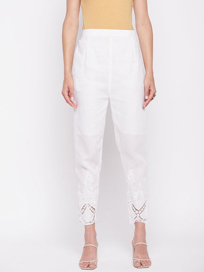 White solid cotton embroidered ankle-length pant with partially elasticated waistband.