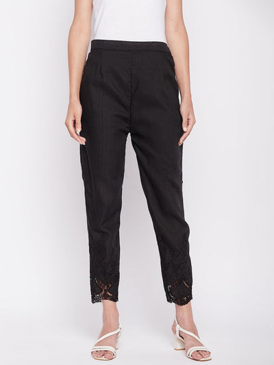 Black solid cotton embroidered pant, ankle length, partially elasticated waistband.