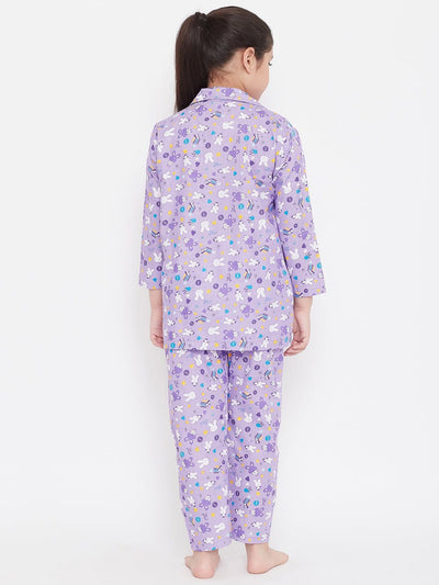Yellow & Purple Printed Rayon Nightsuit Pack of 2, girl wearing purple set.