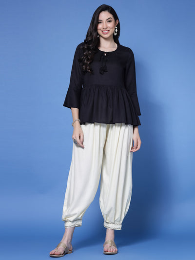 Cream embellished hem design loose fit Afghani salwar with elastic waistband.
